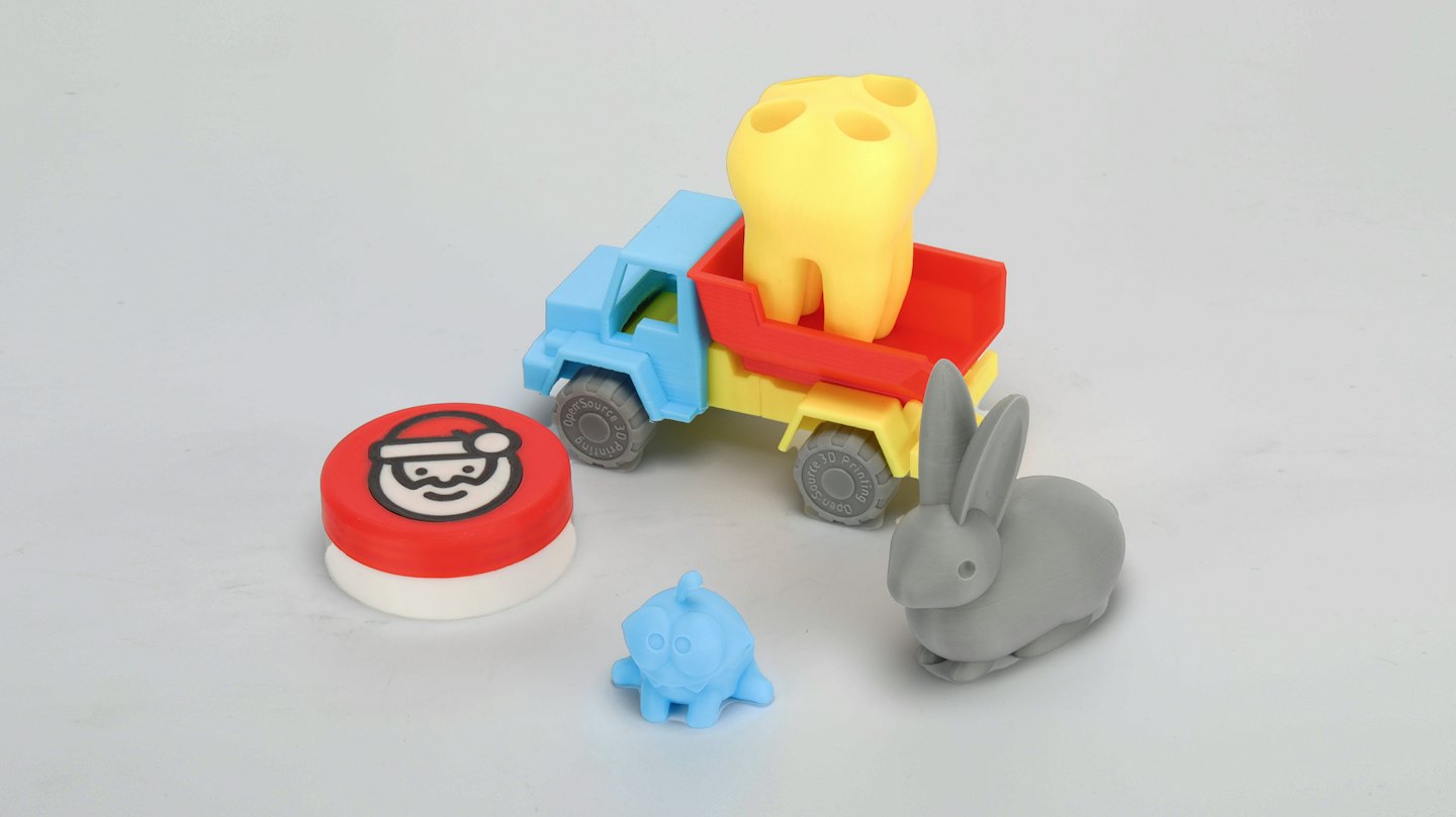 3D printed toys on a toy dump truck.